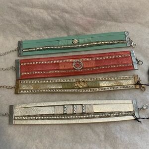 Paparazzi set of four clasp bracelets.